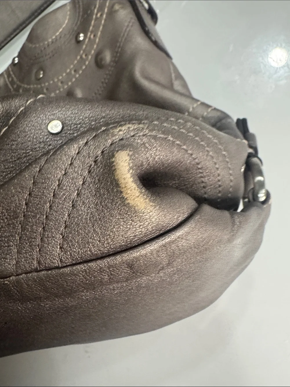 Coach Y2K Madison hobo bag featuring metallic pewter leather and silver studded